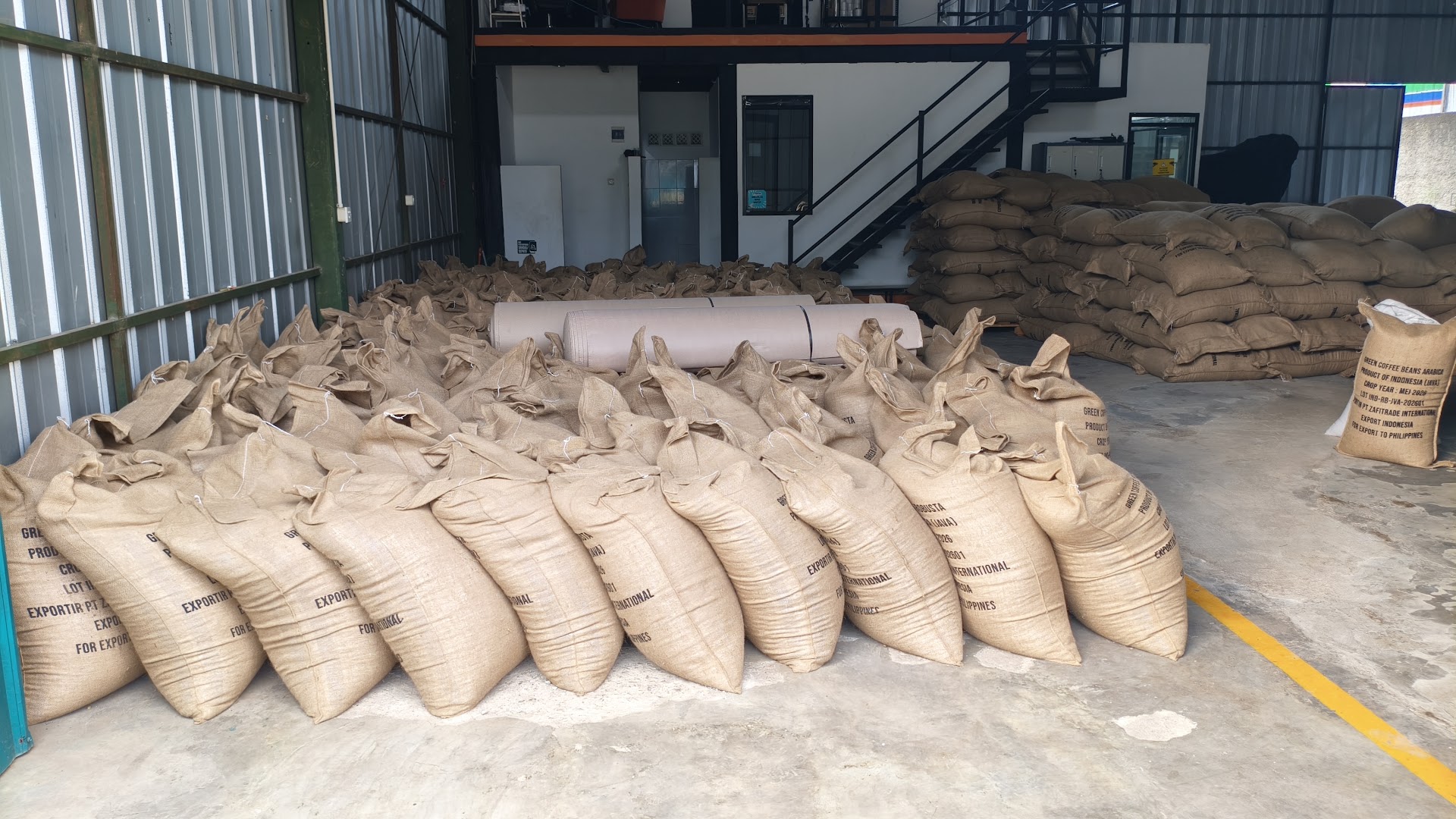 Stacked coffee sacks in the Jaad Food warehouse